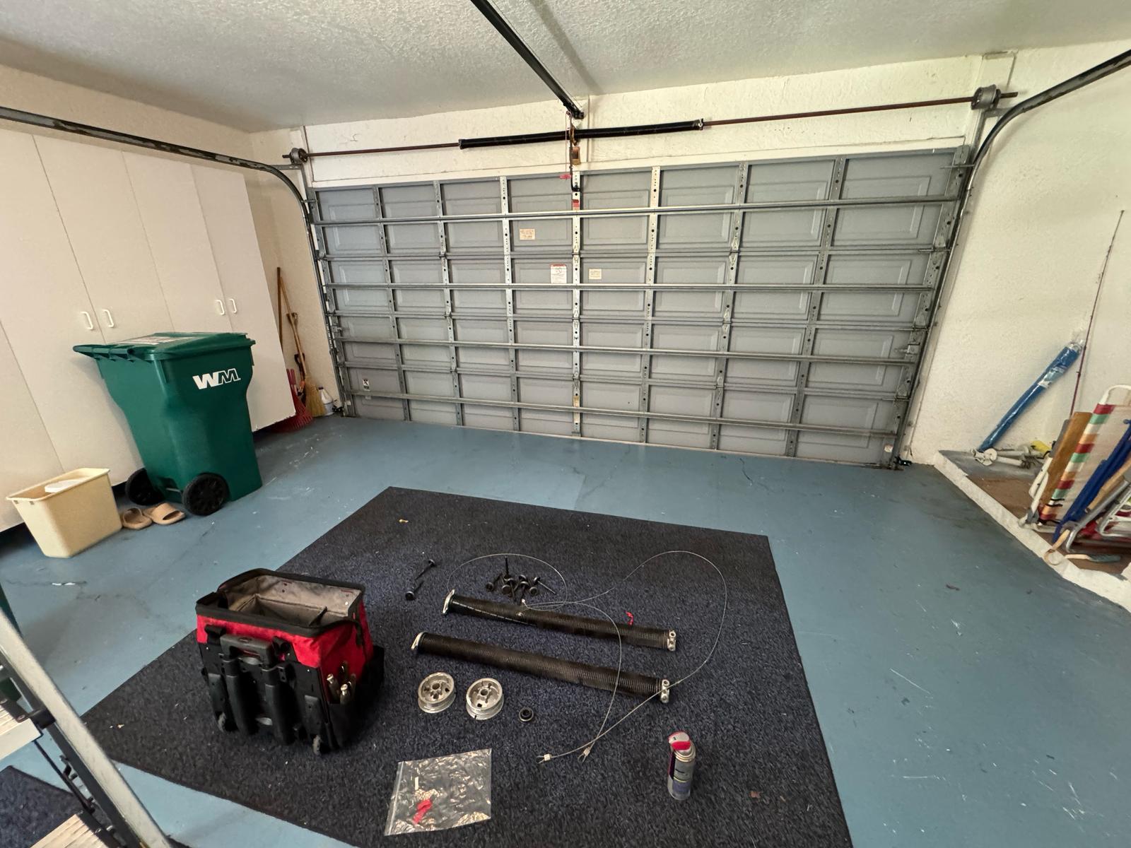 Close-up of garage door torsion spring mechanism